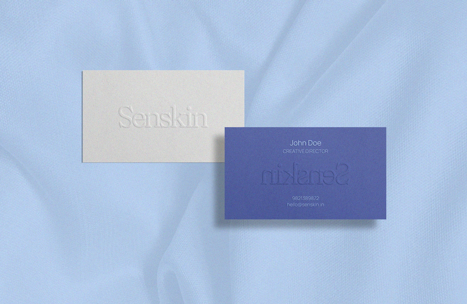 Business cards for a Senskin employee.